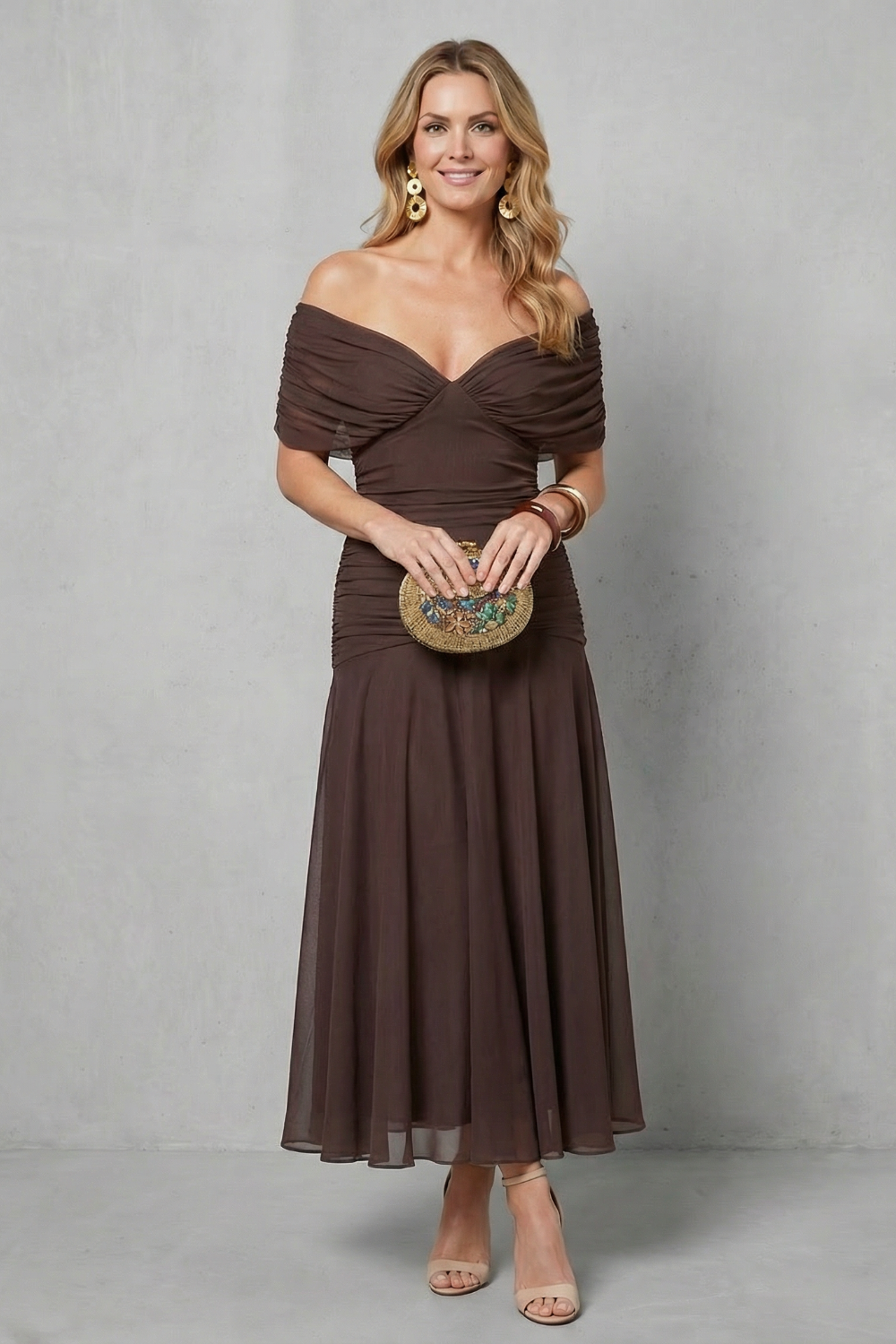 Brown draped off-shoulder maxi dress with ruched sweetheart neckline and sheer chiffon skirt