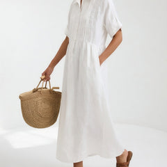 White shirt dress with short sleeves, button front, and gathered waist, midi length
