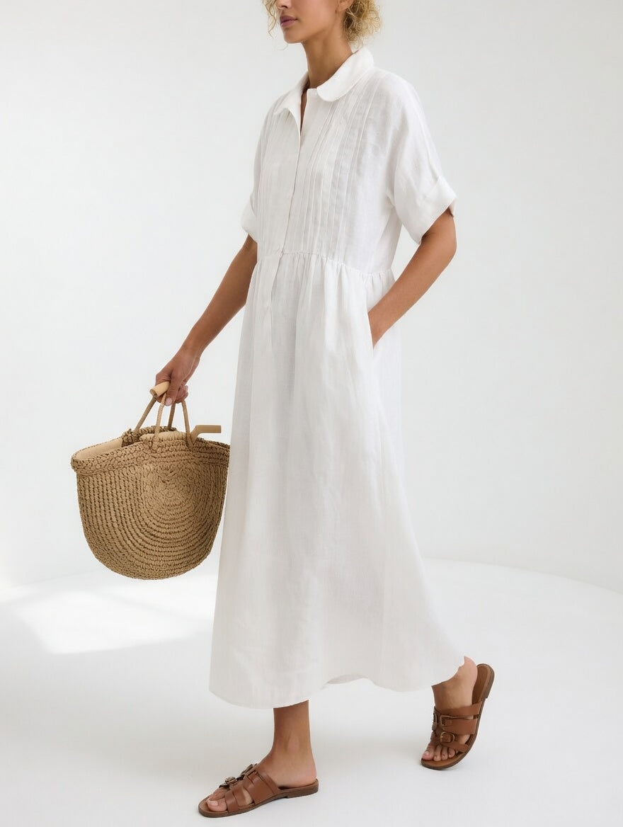 White shirt dress with short sleeves, button front, and gathered waist, midi length