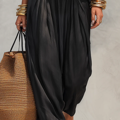 Black gathered maxi skirt with pleated fabric and relaxed drape
