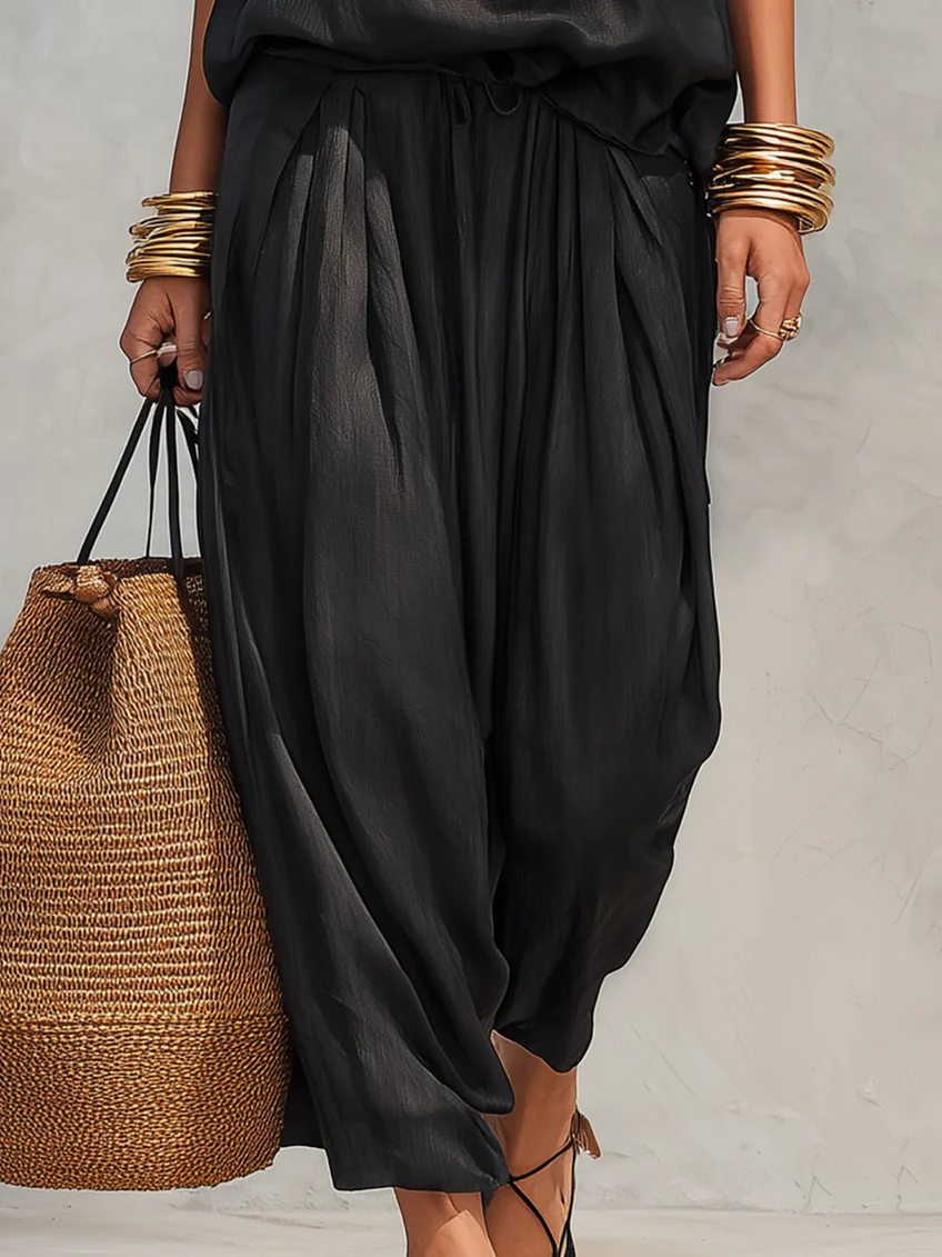 Black gathered maxi skirt with pleated fabric and relaxed drape