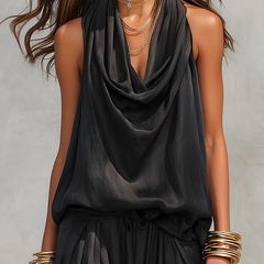 Black sleeveless draped cowl-neck top with gathered waist and tiered skirt