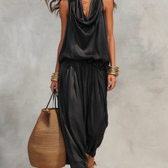 Black two-piece set with sleeveless draped cowl-neck top and gathered maxi skirt