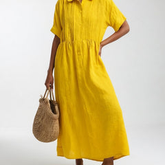 Yellow shirt dress with short sleeves, button front, and gathered waist, midi length