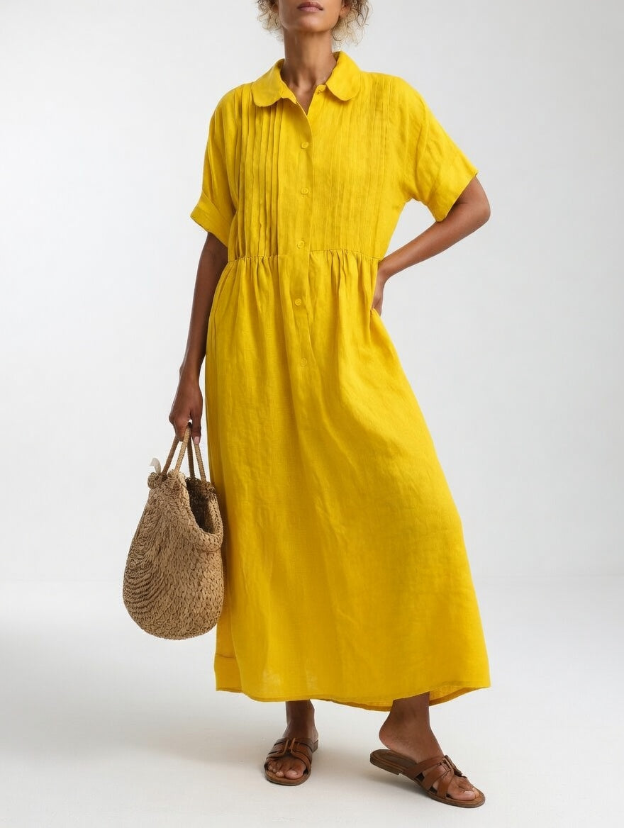 Yellow shirt dress with short sleeves, button front, and gathered waist, midi length