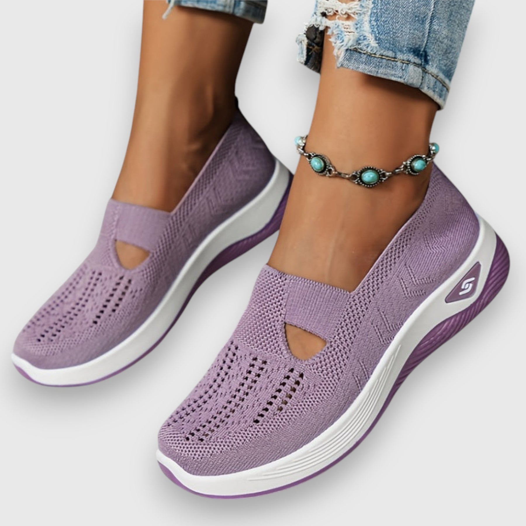 Purple knit slip-on comfort sneakers with cushioned sole and breathable upper
