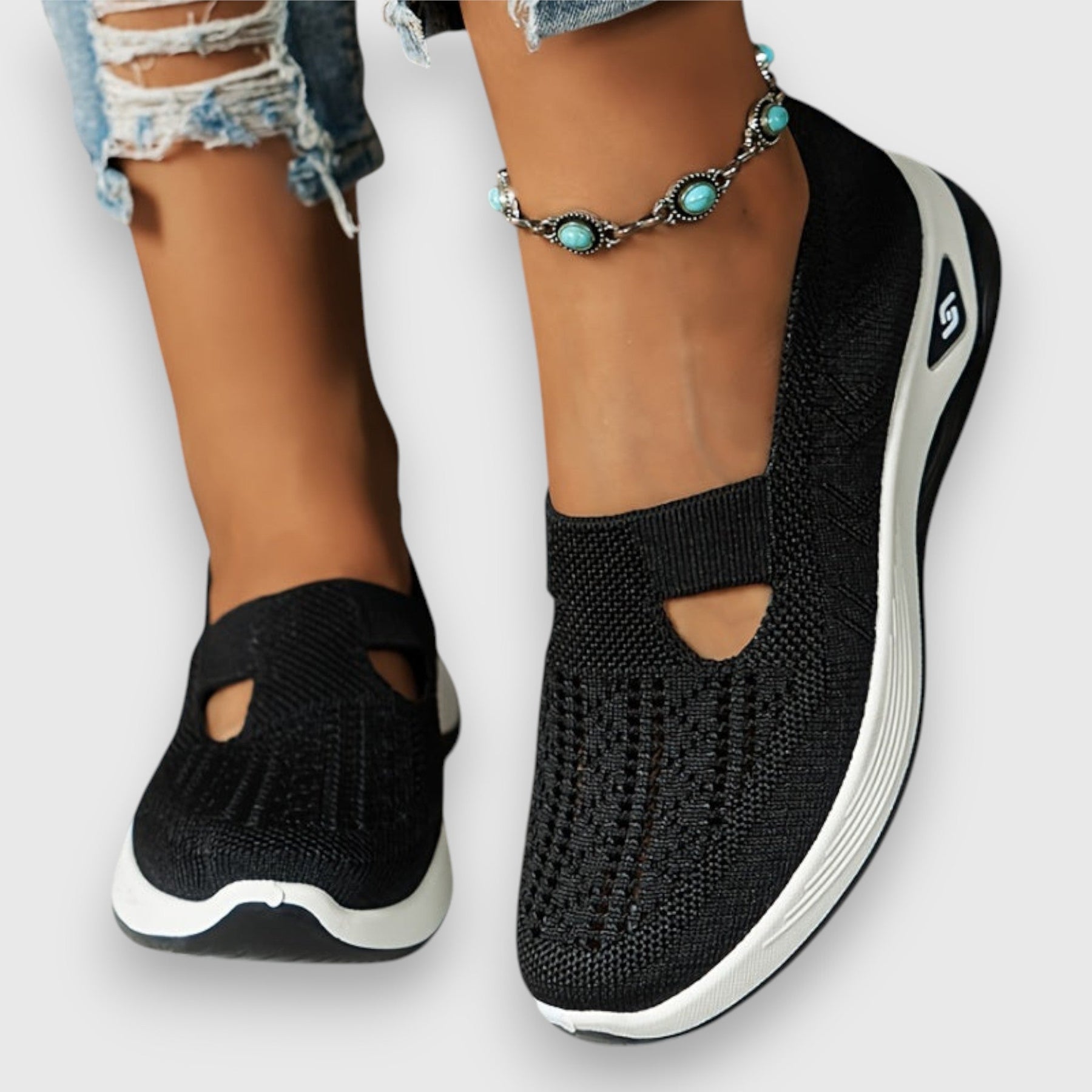 Black knit comfort slip-on sneakers with elastic gore and side cutouts