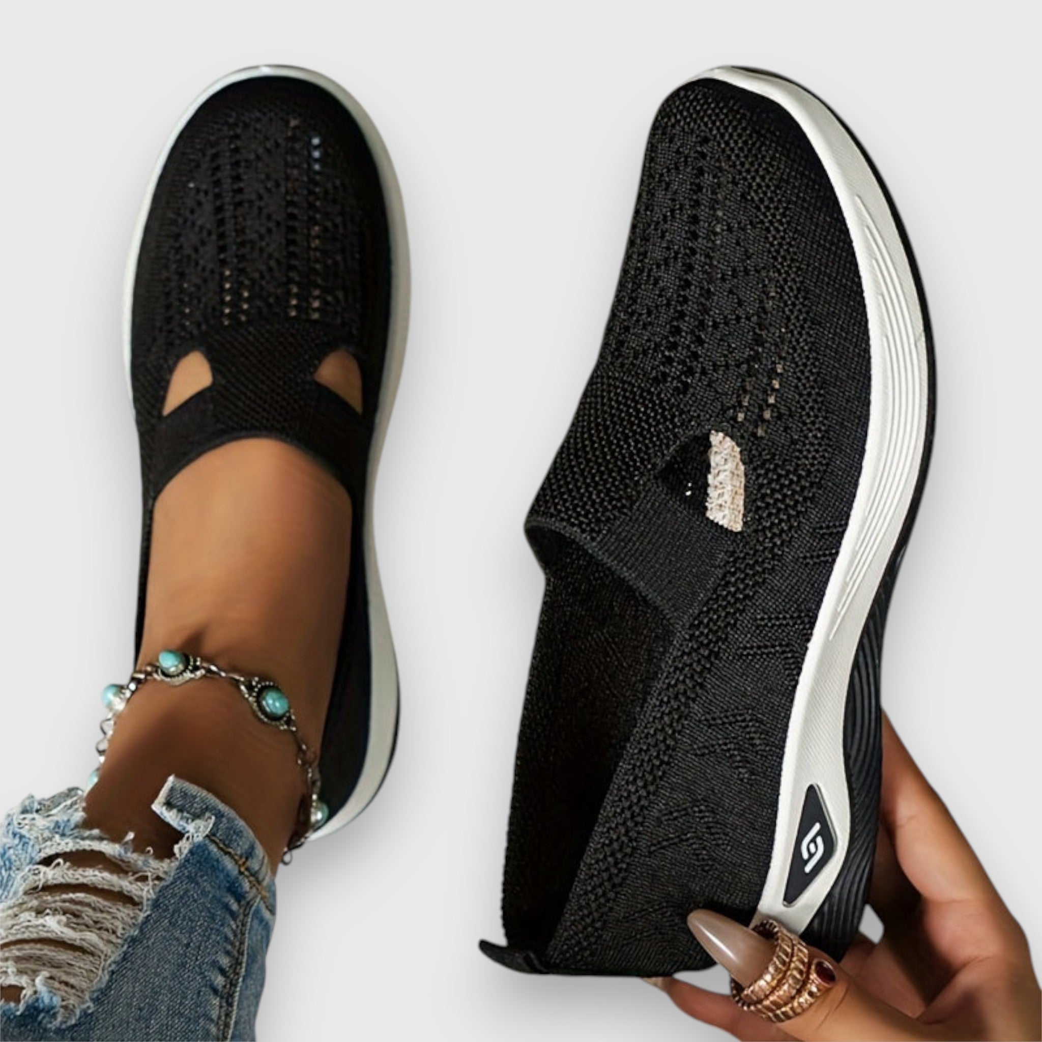 Black knit comfort slip-on sneakers with elastic gore and cutout opening