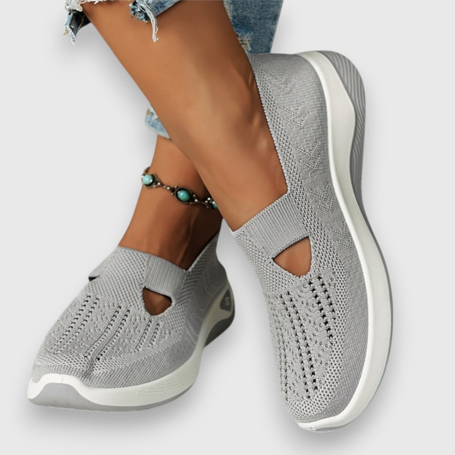 Light grey knit slip-on sneakers with cutout toe and stretchy side panels