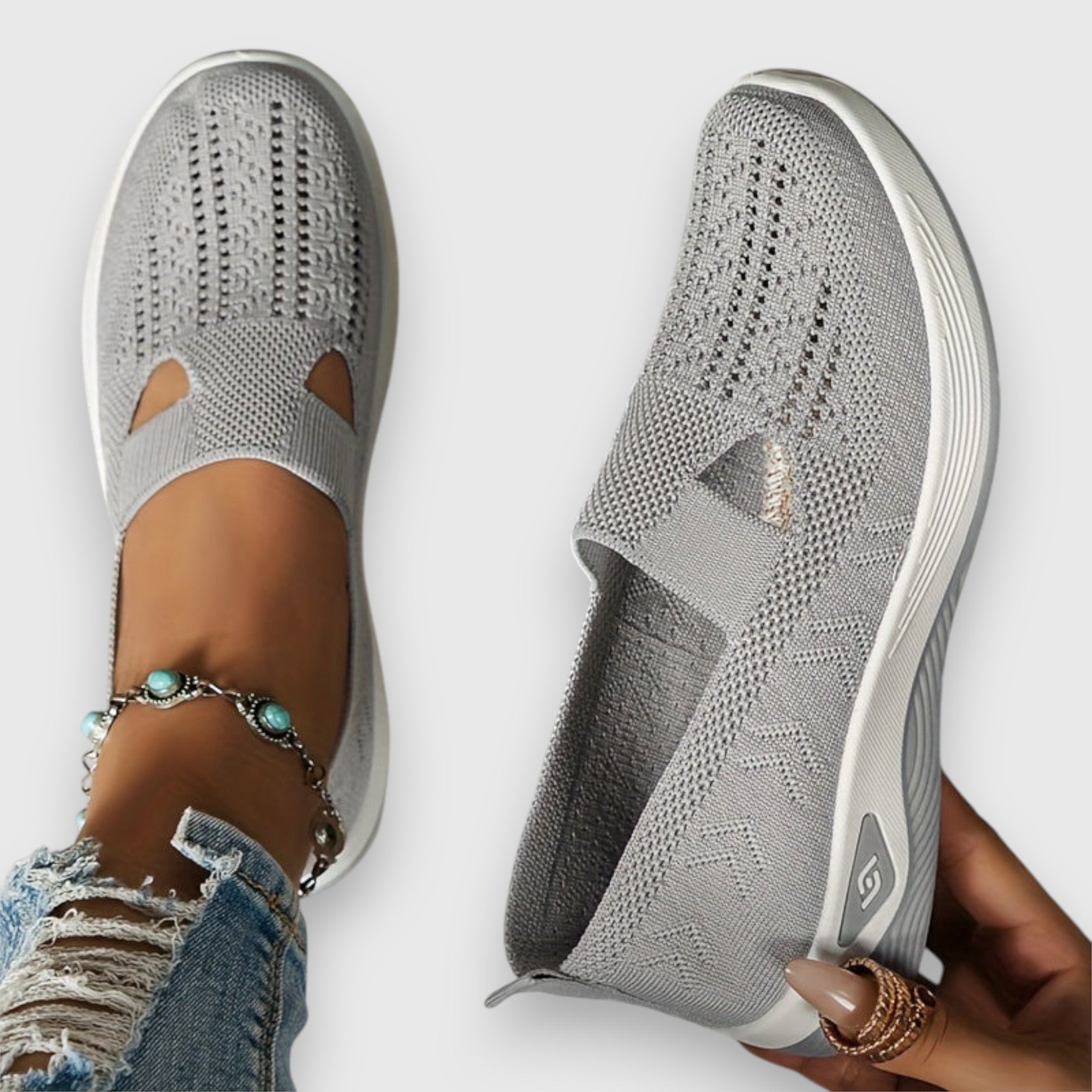 Light grey knit slip-on sneakers, side view showing toe cutout