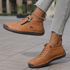 Tan zip-up comfort shoes with lace-up front and side zipper, chain bracelet