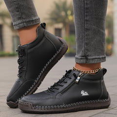 Black zip-up comfort shoes with lace-up front, side zipper tab, and stitched sole