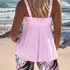Bright ribbed tankini top and shorts (back view), pink with tropical leaf print.