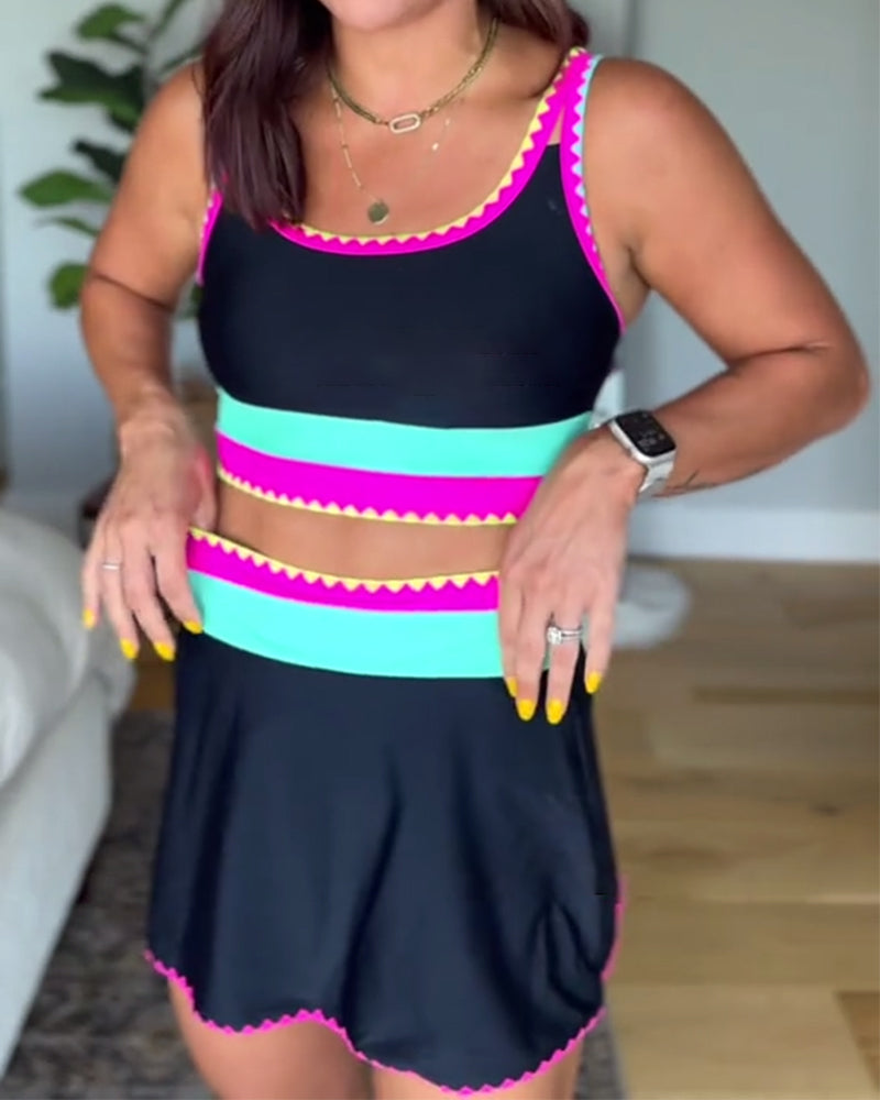 Three-piece color block swimsuit with black, hot pink, and turquoise scalloped trim