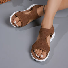 Brown knit open-toe sandals with ankle strap and white cushioned sole