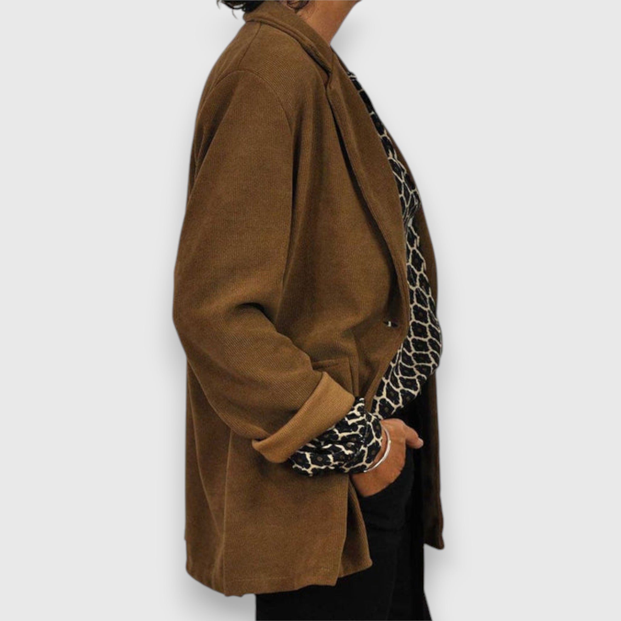 Long-sleeve button-front blouse in brown with black geometric accents at cuffs
