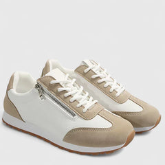 Beige and white comfort sneakers with lace-up front, side zipper, and tan rubber sole