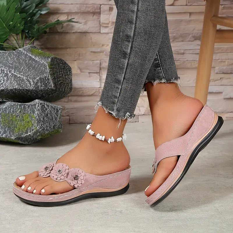 Light pink comfort sandals with floral applique and white beaded ankle strap