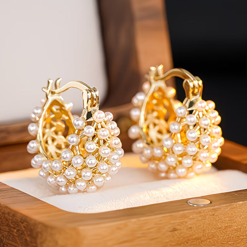 Chunky gold hoop earrings with pearl bead clusters, layered textured design