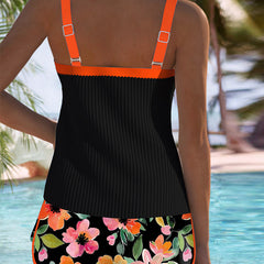 Back view of two-piece tankini set: black tank with orange straps, floral shorts