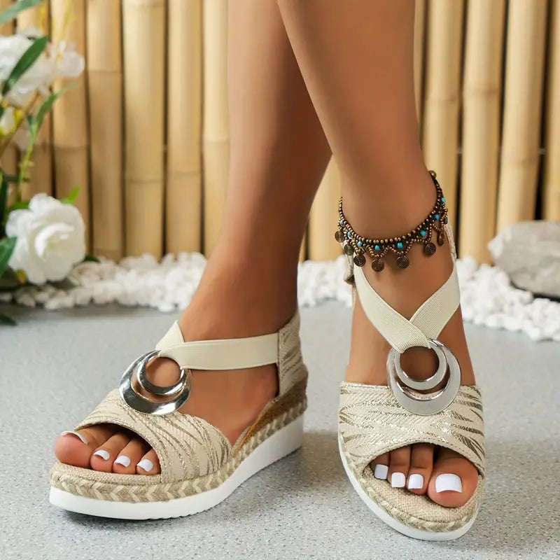 White platform espadrille sandals with metallic ring straps and beaded ankle jewelry