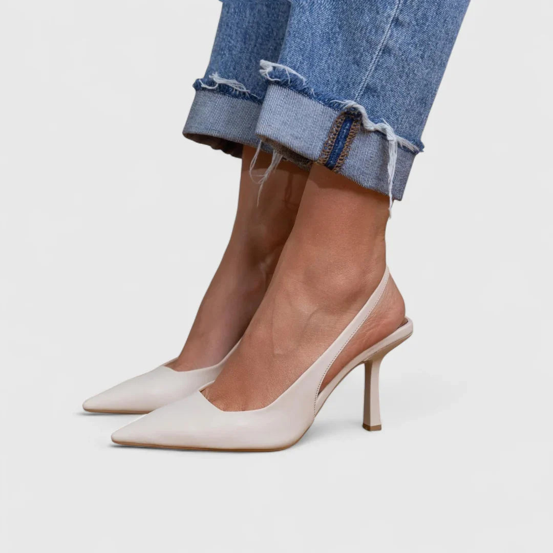 White pointed-toe orthopedic pumps with slim block heel and low-cut vamp