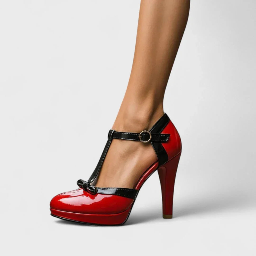 Red platform Mary Jane heels with black ankle strap and round buckle