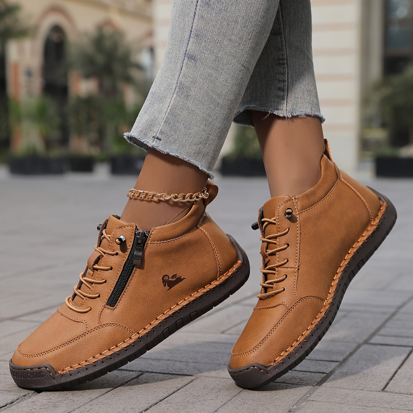 Brown zip-up comfort shoes with lace-up front and side zipper, textured sole