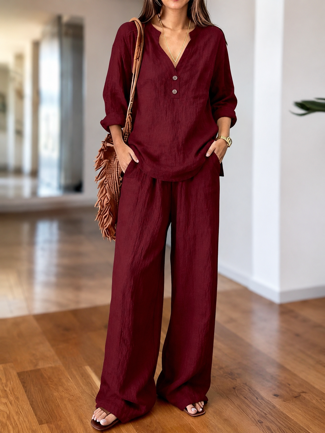 Burgundy long-sleeve two-piece set with V-neck tunic top and wide-leg pants