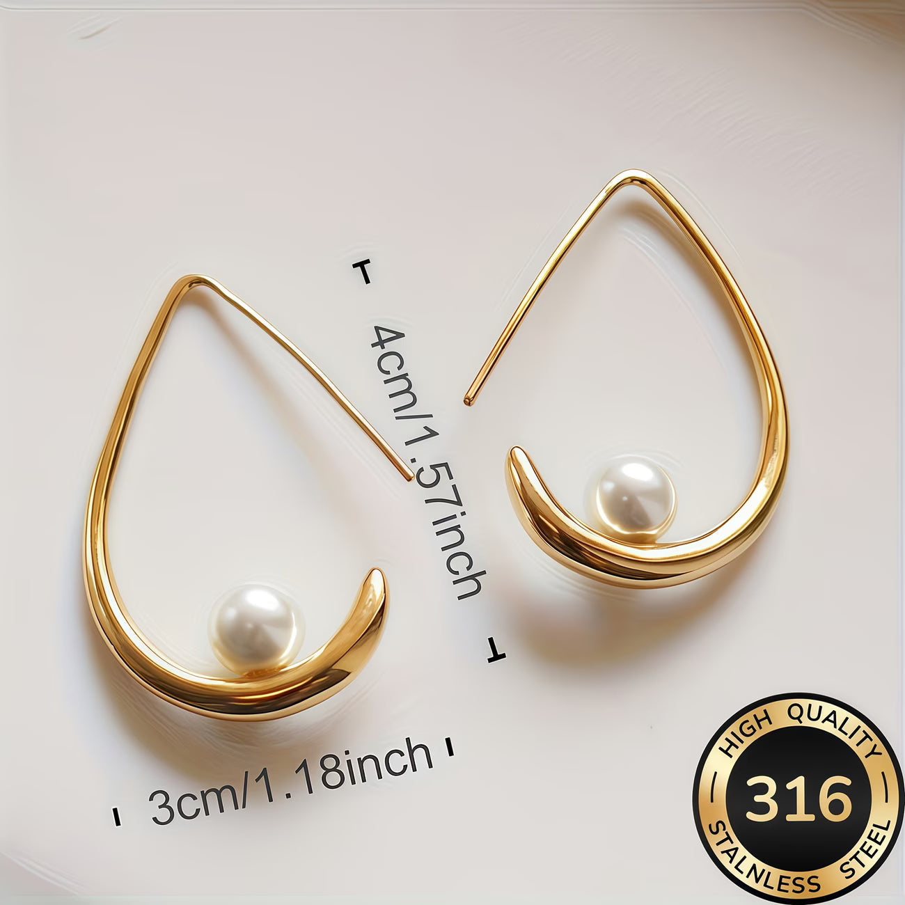 Gold crescent hoop earrings with white pearl, 1.18 in length.
