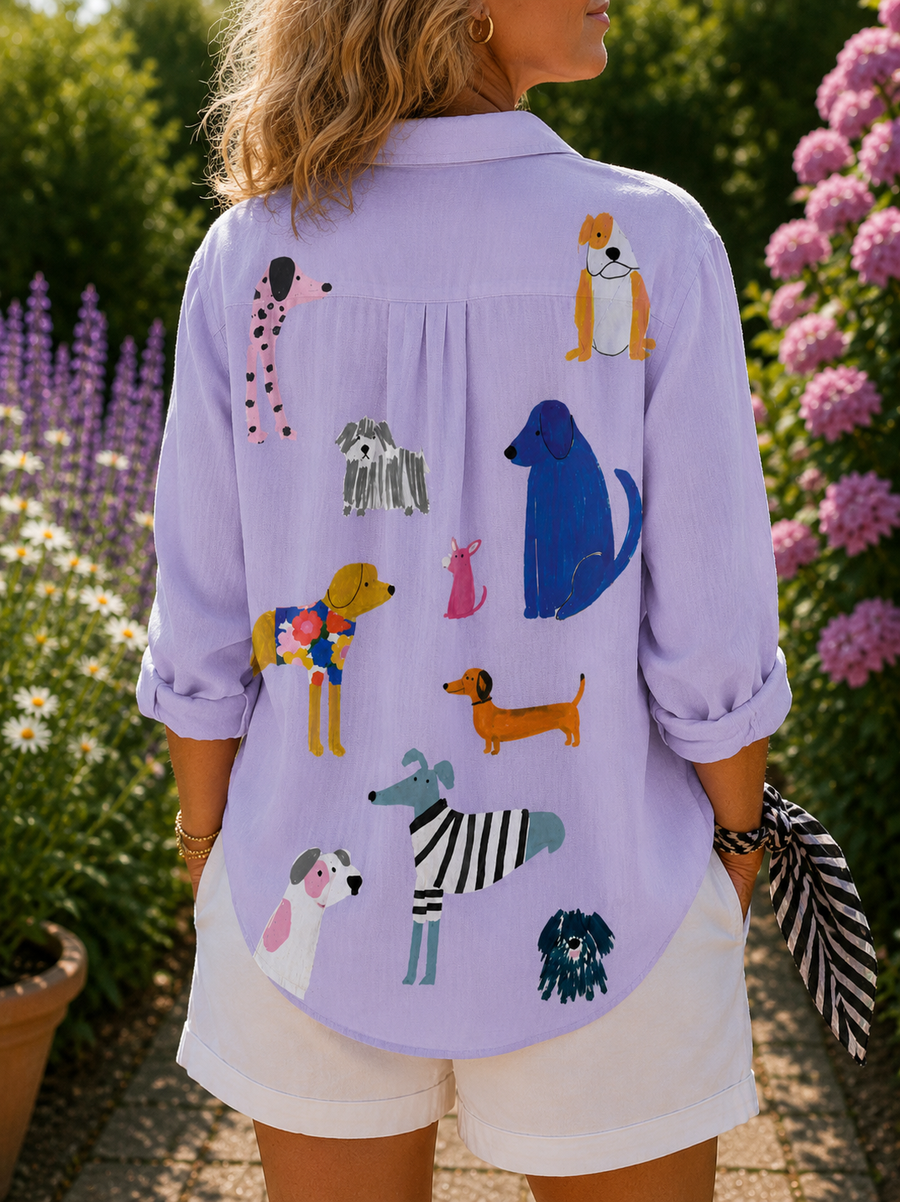 Lavender dog-print button-up blouse, back view with illustrated dogs and folded sleeves