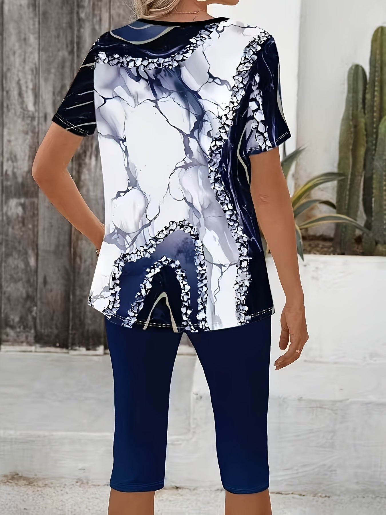 Printed stretch two-piece set, navy capri leggings and patterned short-sleeve top back