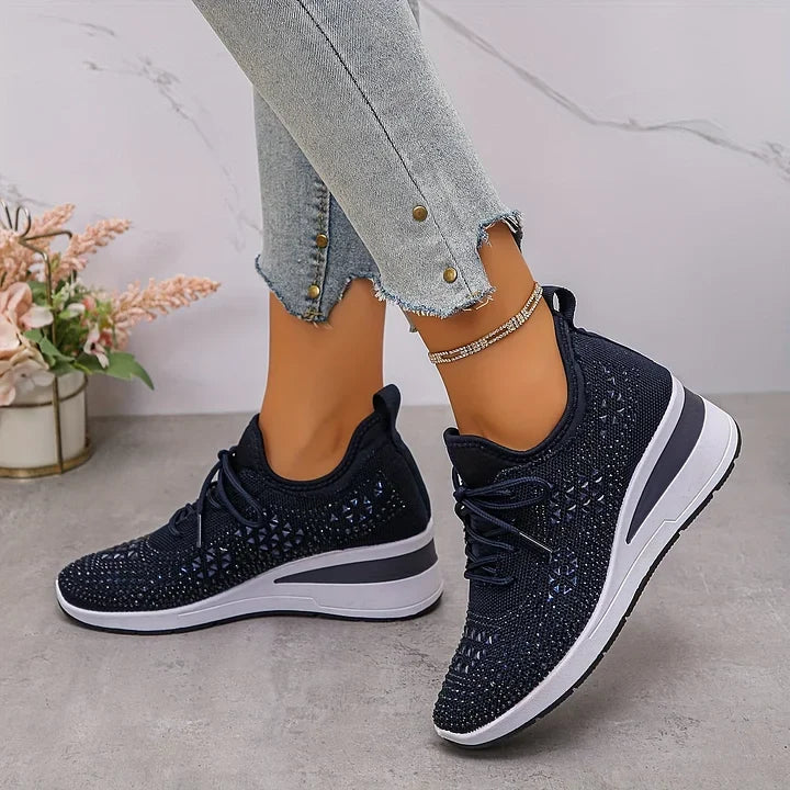 Dark navy comfort sneakers, lace-up knit upper with white sole and cushioned platform