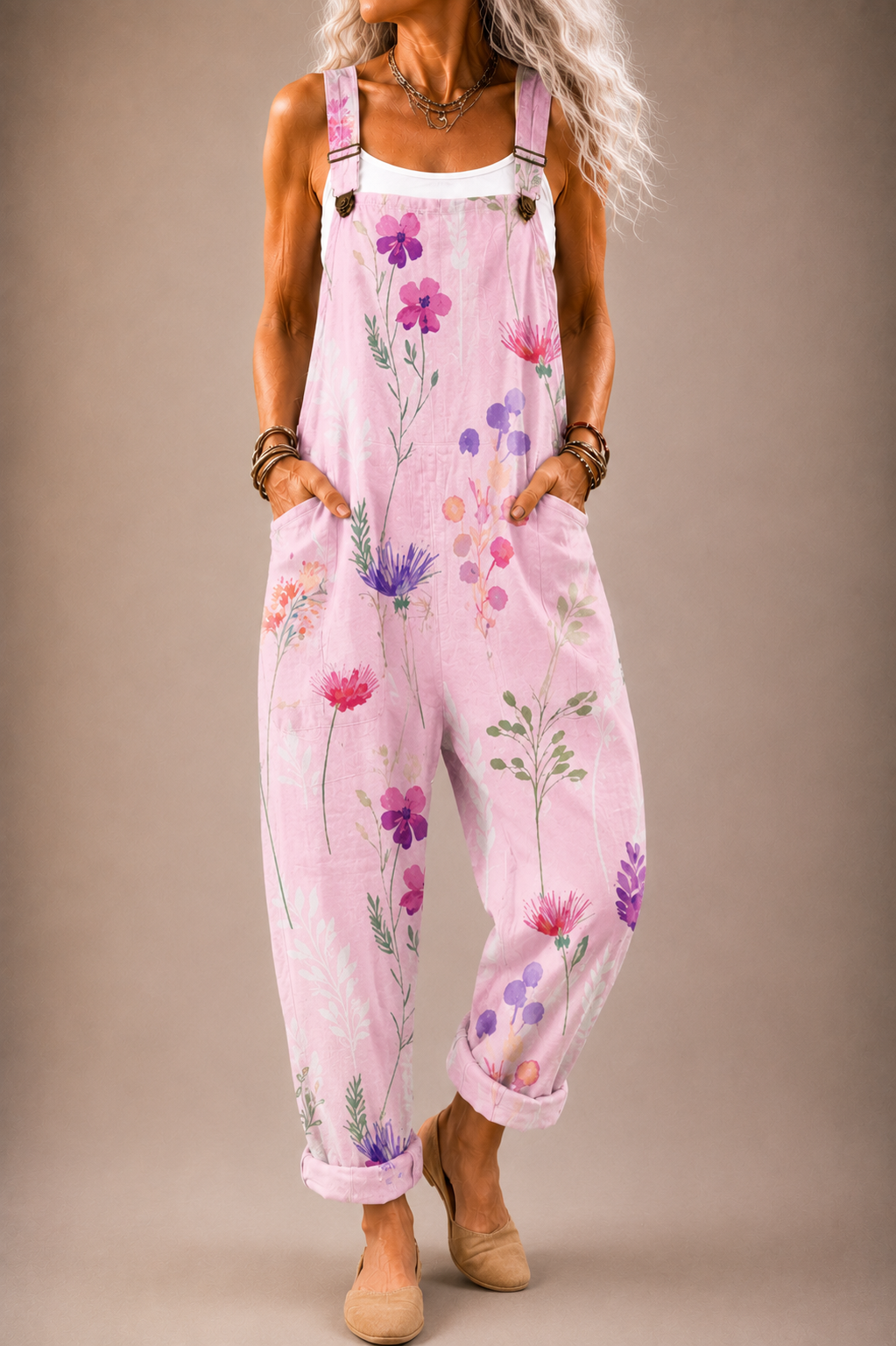 Pink floral printed overalls with adjustable straps and wide-leg bib front