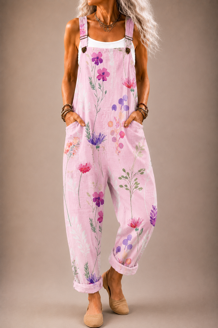 Pink floral printed overalls with adjustable straps and wide-leg bib front