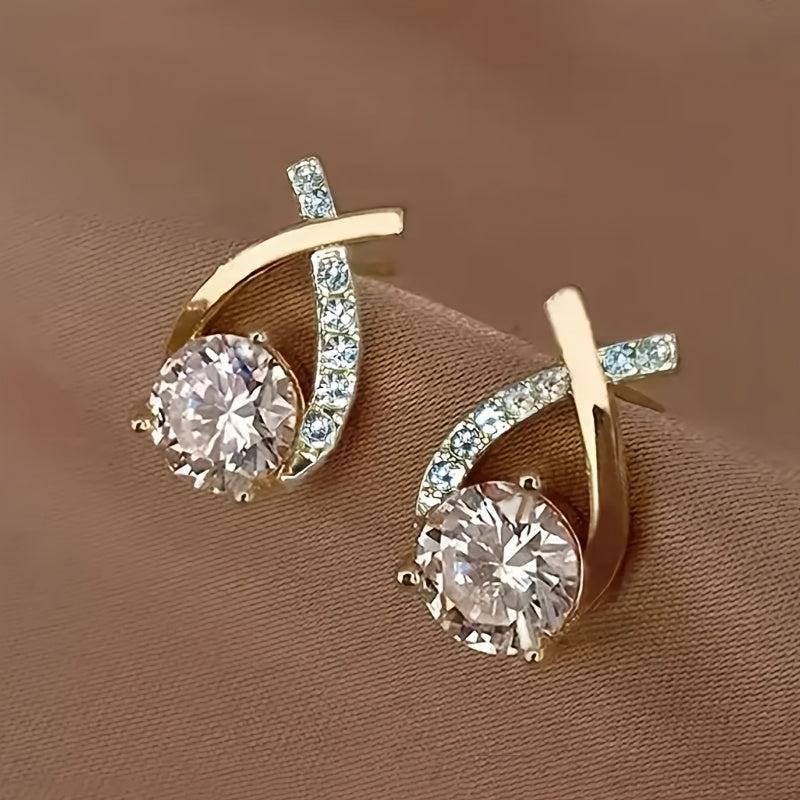 Gold-tone stud earrings with oval hoop frames and round crystal drop stones