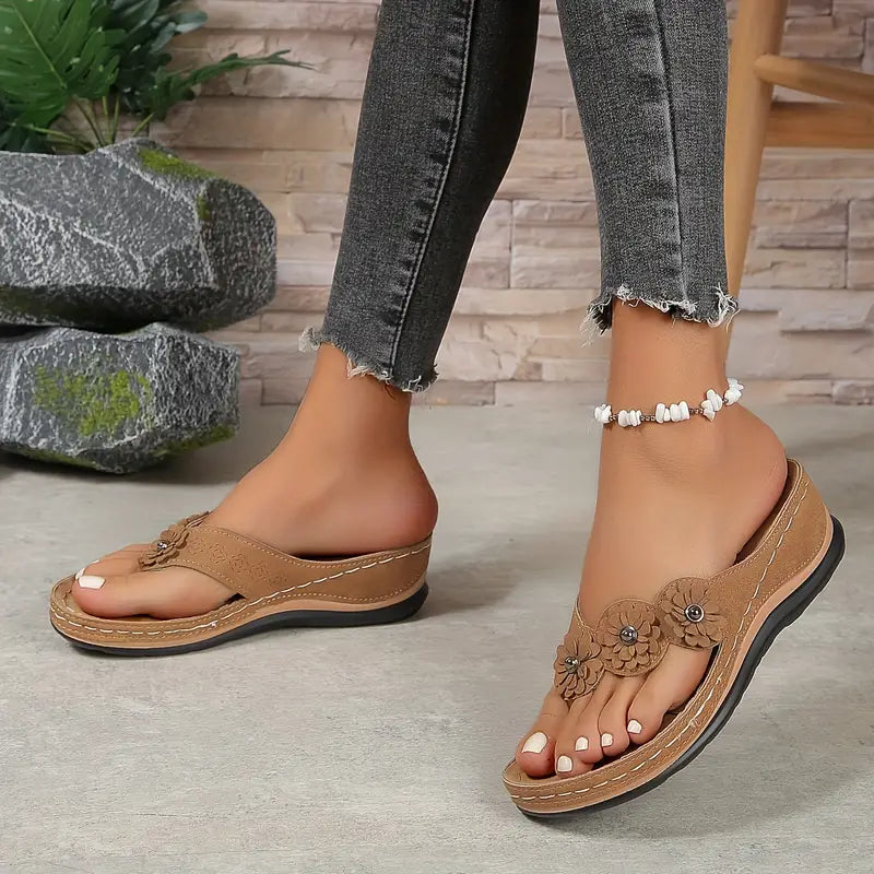 Brown comfort sandals with owl-style flower applique and beaded ankle bracelet