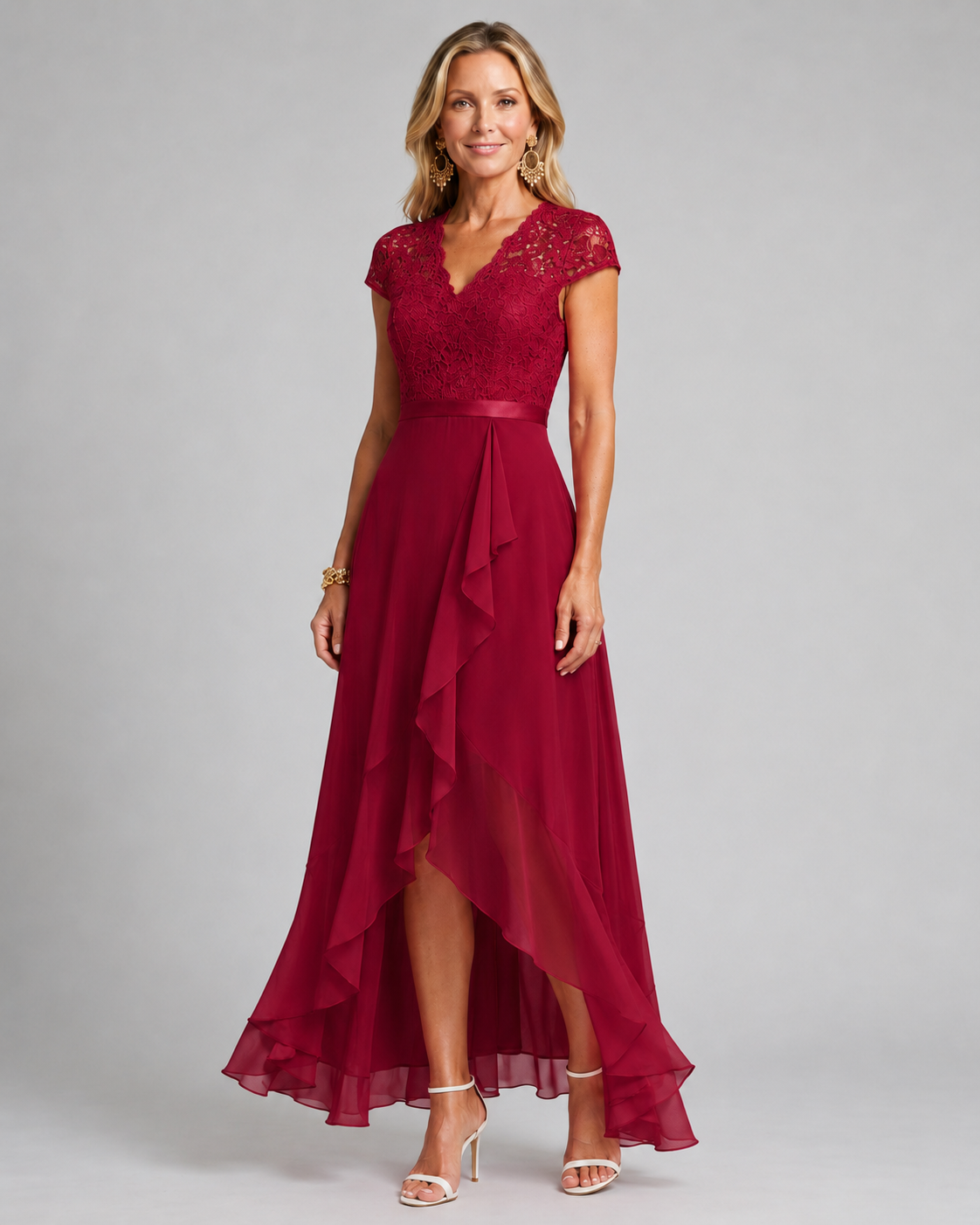 Red lace evening dress with cap sleeves, fitted waist, and asymmetrical ruffle hem