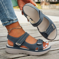 Sky blue sandals with double hook-and-loop straps, open toe, and textured insole