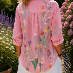 Back view of pink floral blouse with pleated yoke and 3/4 sleeves