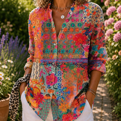 Colorful floral button-up blouse with V-neck and rolled sleeves, front view