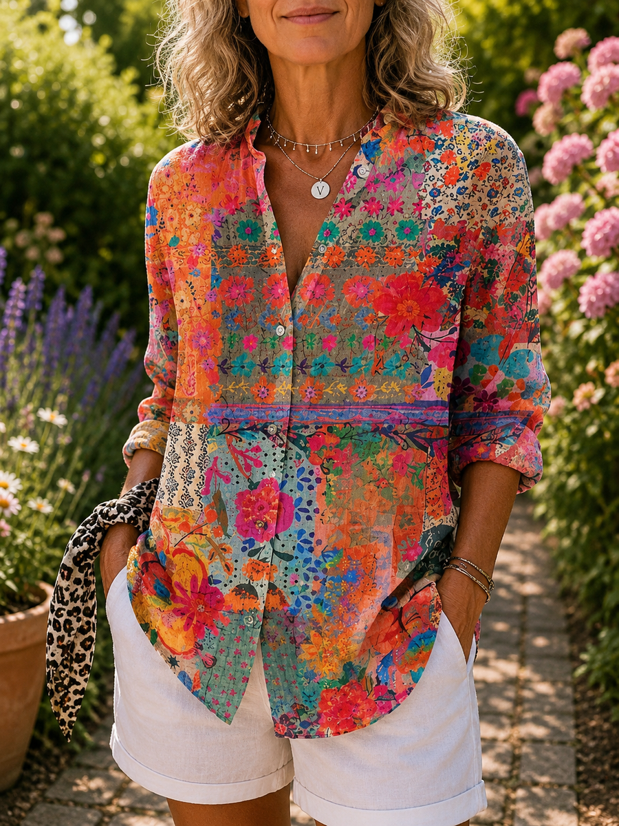 Colorful floral button-up blouse with V-neck and rolled sleeves, front view