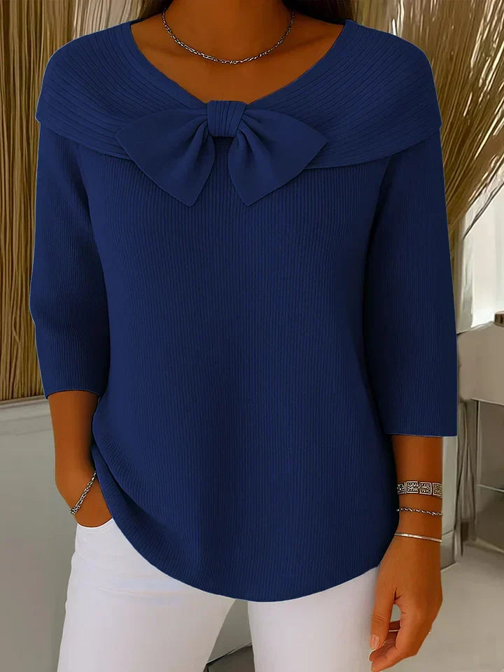 Elegant blue tunic with bow neckline and three-quarter sleeves