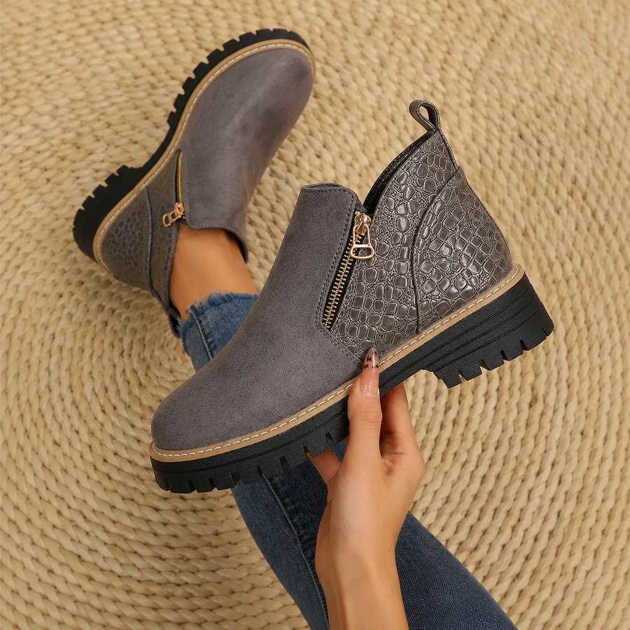 Women's ankle boots in dark gray suede with croc-pattern side panels and zip.