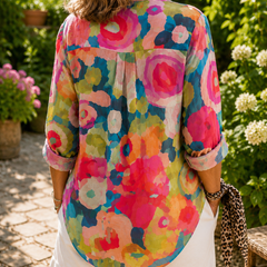Colorful abstract button-up blouse with rolled 3/4 sleeves and curved back hem