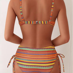 Orange striped two-piece bikini set with tied high-waist bottoms and racerback top