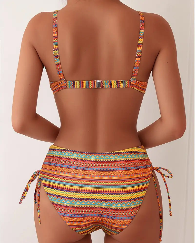 Orange striped two-piece bikini set with tied high-waist bottoms and racerback top