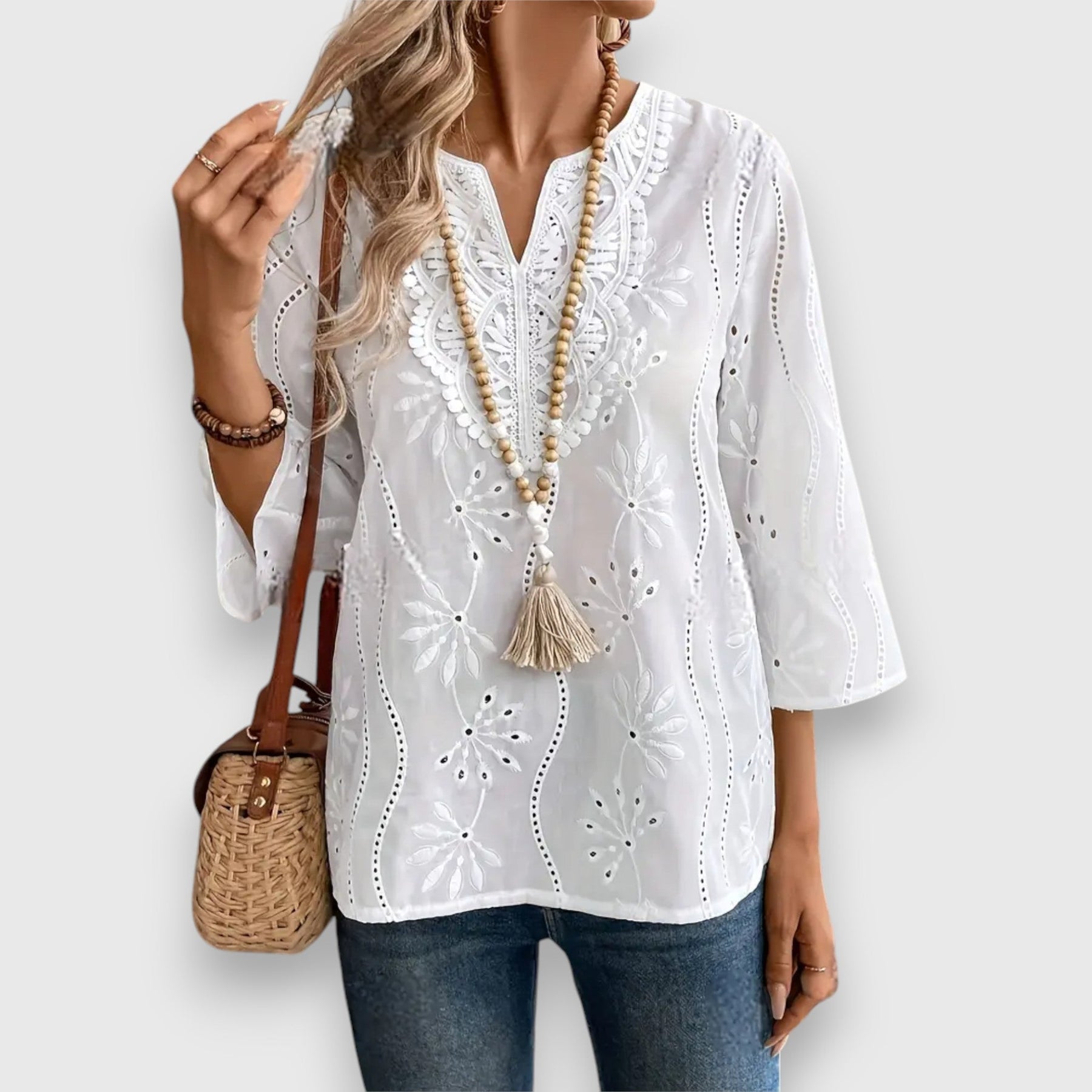 White V-neck embroidered long sleeve blouse with eyelet cutwork front