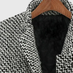 Tweed collar close-up with black lining, showing thick textured herringbone weave