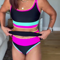 Three-piece swimsuit set in black with hot pink and turquoise stripes, cropped top and briefs